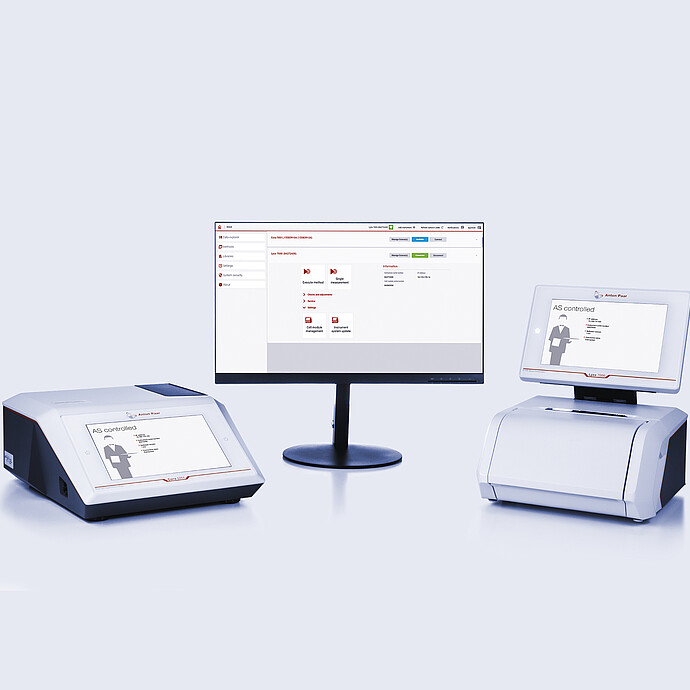 Cora 5001 Raman spectrometer and Lyza 7000 FTIR spectrometer connected to a central monitor displaying the Spectroscopy Suite spectral analysis software