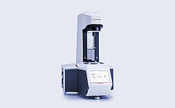 Anton Paar MCR 53 Modular Compact Rheometer in three-quarter view with open measuring area and touchscreen home menu.