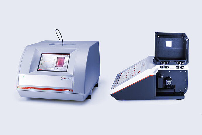 Anton Paar Monowave 400 R microwave synthesis reactor (left) and Cora 5001 Raman spectrometer (right) with an open sample compartment. The Monowave 400 R displays reaction monitoring data on its touchscreen, while the Cora 5001 enables real-time molecular spectroscopy analysis.