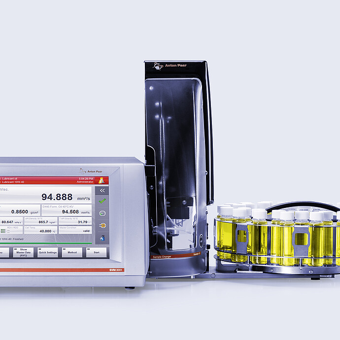 Anton Paar SVM 3001 viscometer with Xsample 530 sample changer, clear cover, and vial carousel filled with yellow samples
