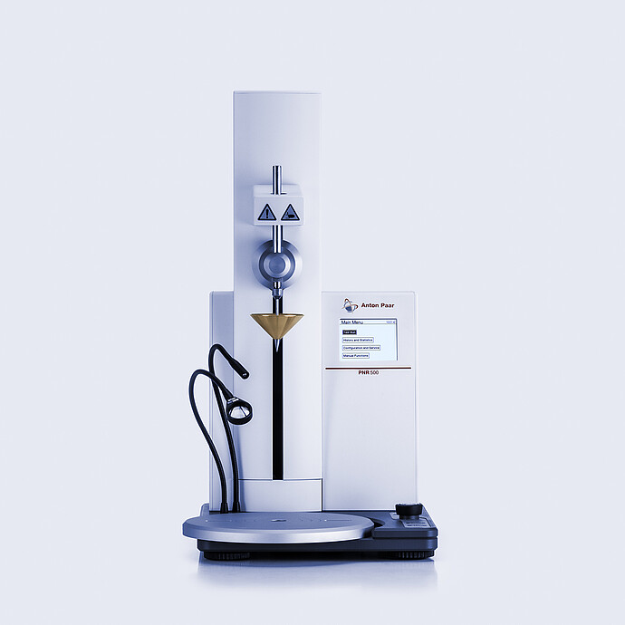 Anton Paar Penetrometer PNR 500 with touchscreen display, connected cone assembly, and sample positioning platform.