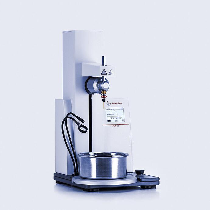 Anton Paar Penetrometer PNR 500 with sample cup positioned for penetration measurement and touchscreen showing completed test.