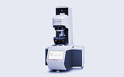 Anton Paar MCR 93 Modular Compact Rheometer in three-quarter view with mounted measuring hood and touchscreen home menu.