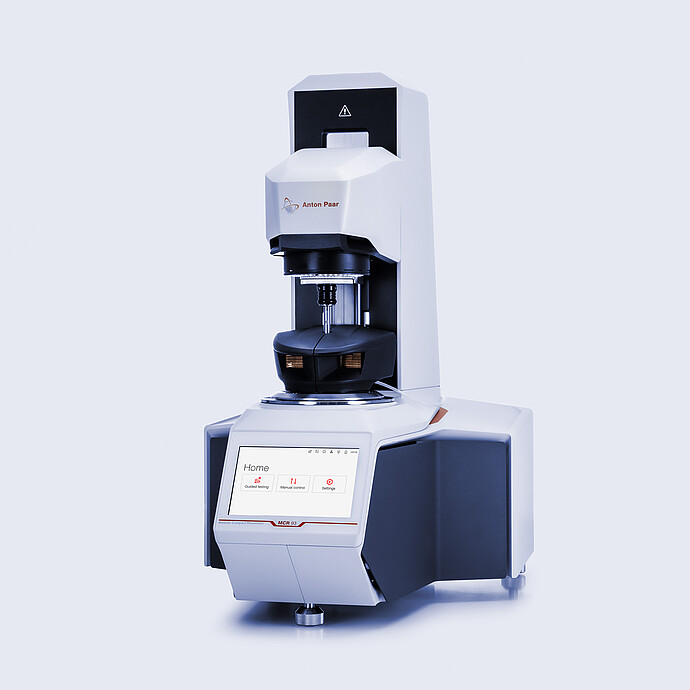 Anton Paar MCR 93 Modular Compact Rheometer in three-quarter view with mounted measuring hood and touchscreen home menu.
