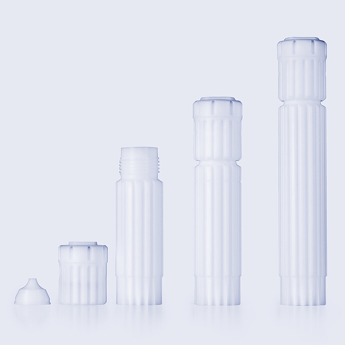 HVT Rotor vessel components in different sizes, including caps and inserts, arranged in a row on a light background