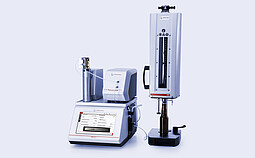 Anton Paar DMA 5000 M with Alcolyzer Beer ME and filling module connected to PFD measuring device holding a brown glass bottle