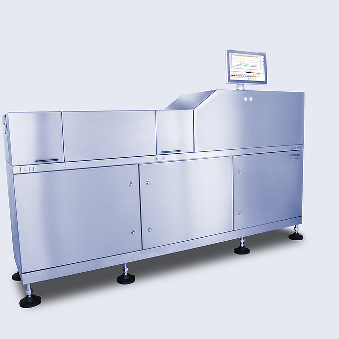 Angled view of Brabender TwinLab B-TSE-S-30-40 twin-screw extruder with closed stainless steel housing and top-mounted touchscreen