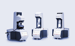 Three Anton Paar Entry Level Rheometer MCR instruments with different measuring setups and touchscreen home menus.
