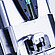 Close-up of Anton Paar Xsample 340 sample changer with 1 mL syringe above a cleaner port and connected tubing