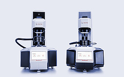 Anton Paar SmartMelt 73 and SmartMelt 303 polymer melt rheometers shown side by side on a light background.
