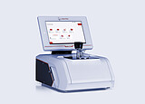 Anton Paar Lyza 7000 FTIR spectrometer with an integrated touchscreen showing the home menu and a mounted sample holder.