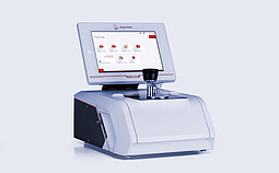 Anton Paar Lyza 7000 FTIR spectrometer with an integrated touchscreen showing the home menu and a mounted sample holder.