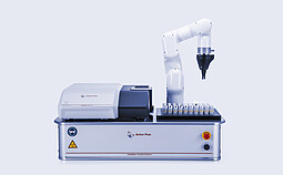 Litesizer DLS 701 nanoparticle analyzer combined with Litesizer Cuvette Sampler and robotic arm automatically loading multiple sample cuvettes on an Anton Paar automation platform.